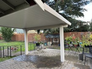 Flatpan Patio Cover With Maplewood Cedar Embossed Wrap And Scallopped Rafter Tails In Rochester 4